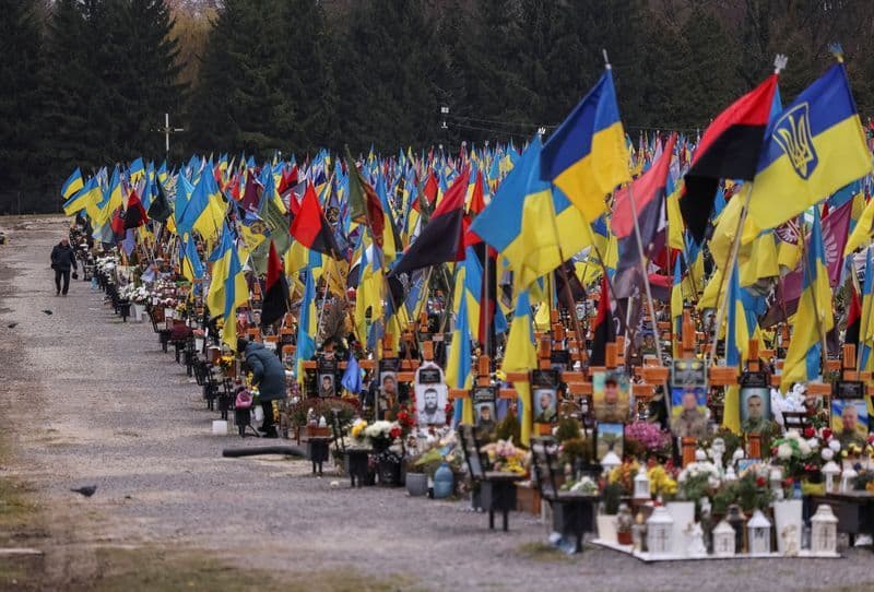 At crowded Ukrainian cemetery, mourners yearn for war to end