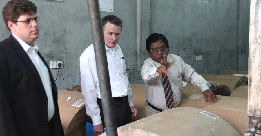 Chris Murphy and another official from the US Senate Foreign Relations Committee inspecting printing press of Uthayan newspaper in Jaffna on 7 December 2013 while talking with E. Saravanapavan, the Managing Director of the newspaper.